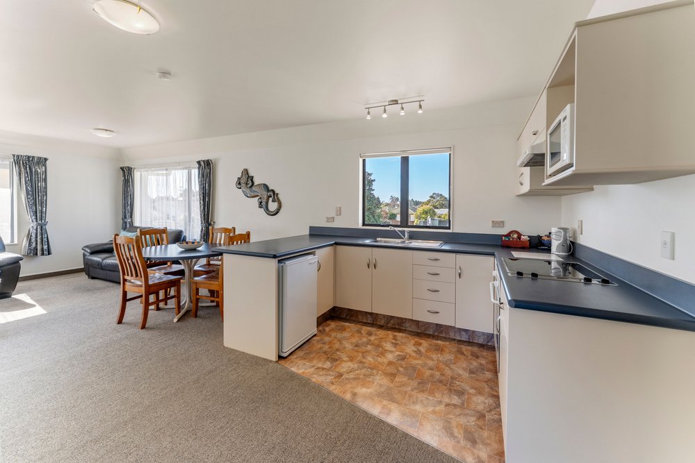 Kitchen and dining areas in Avalon Motels family accommodation